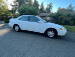 1999 Toyota Camry CE in white, manual transmission, well-maintained with clean title and great fuel economy.