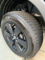 Close-up of a Michelin tire on a 2017 Honda Ridgeline Black Edition, showcasing the unique wheel design.