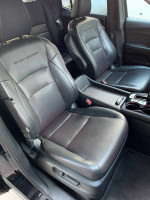 Interior of a 2017 Honda Ridgeline Black Edition with black leather seats and intricate detailing.