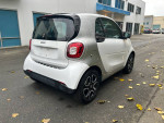 2016 Smart Fortwo Pure in excellent condition, showcasing rear view and unique aluminum wheels.