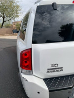 Rear view of a 2004 Nissan Armada LE 4WD showcasing its taillights and logo.