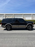 2001 Ford Excursion Limited RWD 7.3 Diesel, black exterior, 22-inch wheels, well-maintained, for sale $15,000