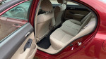 Interior view of a 2010 Honda Civic LX showing back seats with beige upholstery and clean condition.