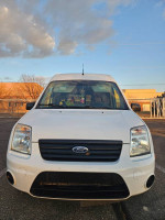 Front view of a white van ideal for contractors and outdoor adventures, located in Grand Junction.
