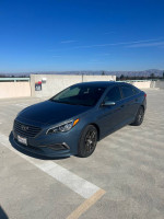 2016 Hyundai Sonata SE in great condition with low mileage parked in a sunny location.