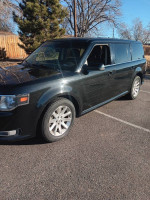 2013 Ford Flex SEL in black with clean interior and third-row seating parked outside.