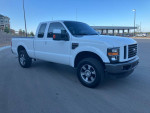 2008 Ford F250 Superduty Diesel truck with low mileage, clean exterior and features like tonneau cover and leather seats