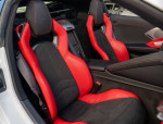 Interior of 2022 Chevrolet Corvette Stingray showing red leather GT2 bucket seats and sporty design.