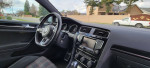 Interior view of a 2015 Volkswagen GTI with modern dashboard and steering wheel.