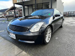 2005 Infiniti G35 Coupe in black with aftermarket rims, clean title, and low mileage of 137,000 miles