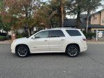 2011 GMC Acadia Denali in white with a clean exterior and two-wheel drive parked on the street.