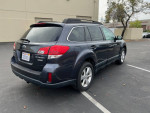 2013 Subaru Outback 2.5L Premium AWD parked, showcasing clean title and family-friendly features.