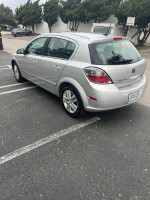 2008 Saturn Astra XE FWD silver hatchback parked, showcasing its low mileage and good condition