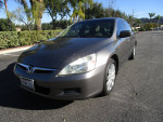 2006 Honda Accord EX FWD in excellent condition with leather interior and 54k miles, parked outdoors