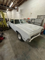 1968 Chevrolet Impala Custom Coupe in garage, showing classic style and well-maintained condition with 62,000 miles.