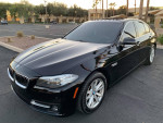 2015 BMW 5 Series 528i in black exterior, parked with features like navigation and sunroof.