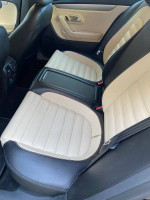 2012 Volkswagen CC interior showing beige and black leather seats in excellent condition