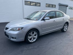 Silver Mazda 3 sedan for sale, low mileage at 102,000 miles, in excellent condition.