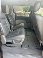Interior view of a 2009 Chrysler Town and Country Limited showing rear seating with gray leather upholstery.
