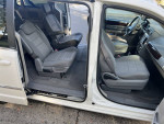Interior view of a 2010 Chrysler Town and Country with folded seats for additional cargo space.