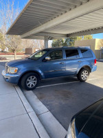 2008 Chrysler Aspen in blue, parked with tinted windows, featuring third-row seating for large families.