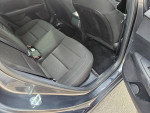Interior view of 2021 Kia Forte LXS with spacious rear seating and black upholstery in good condition.