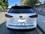 2020 Lexus NX 300 in excellent condition with new tires and roof rack, parked on the street.