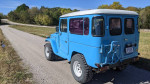 1977 Toyota Landcruiser BJ40 in blue, showcasing upgraded features and off-road capability.