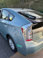 2014 Toyota Prius Plug-in in seagreen color with 119,000 miles, showcasing sleek exterior and modern features.