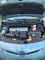 2014 Toyota Prius engine compartment, showcasing hybrid technology and components in excellent condition.