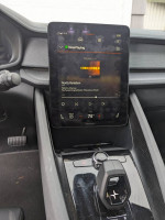 Interior view of a 2021 Polestar 2 showing infotainment screen and gear shifter