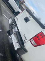 Rear view of a 2013 Nissan Titan SV 4WD parked, showcasing its design and features.