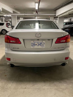 2007 Lexus IS 250 RWD parked in a garage, showcasing clean design and features.