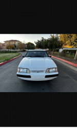 Front view of a clean 1989 Ford Mustang LX 5.0 with low mileage and original features.