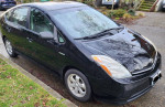 2009 Toyota Prius parked, showcasing its sleek design and hybrid features.