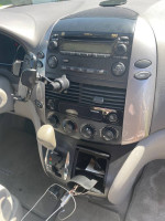 Interior view of a 2009 Toyota Sienna LE showing dashboard controls and gear shift.