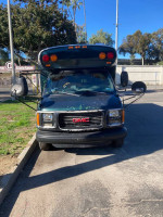 2002 Chevy Bluebird school bus conversion with turbo diesel engine parked outdoors