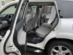 Interior view of a 2012 Toyota RAV4 showing well-maintained seating and spacious layout.