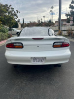 Rear view of a 1997 Chevrolet Camaro Z28 in pristine condition, showcasing its classic design and clean lines.
