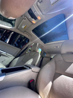 Interior view of a 2011 Volvo XC60 showing leather seats and panoramic sunroof