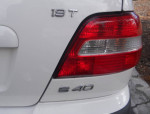 Close-up of the rear badge of a 2001 Volvo S40 luxury sedan with white paint and 19T turbo emblem.