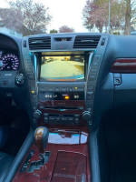 Interior view of a 2007 Lexus LS460 showing advanced controls and a rear view camera for safety.