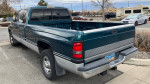 1996 Dodge Ram 2500 Cummins extended cab and long bed truck parked, showcasing its durable exterior and design.