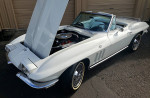 1965 Chevrolet Corvette Stingray Convertible in white with open hood showcasing engine details