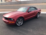 2008 Ford Mustang convertible in red, excellent condition with 92,000 miles, stylish and fun to drive.
