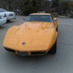 1973 Chevrolet Corvette Stingray in bright yellow, showcasing custom design and classic style.