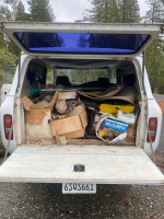 1972 International Scout showing cluttered cargo area, includes tools and boxes, needs restoration.