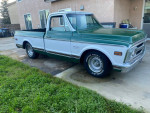 1972 GMC C10 original short bed truck with V8 engine parked on grass.