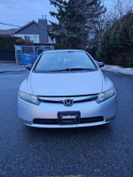 Front view of a 2006 Honda Civic in mint condition with low mileage and excellent maintenance.