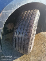 Close-up of a tire on a 2000 Honda Odyssey, showcasing tread and condition for potential buyers.